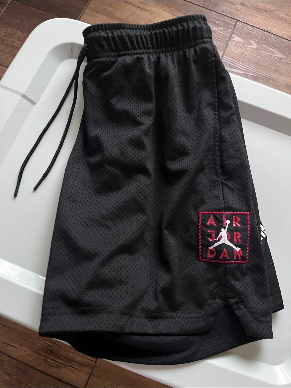 Jordan Men’s Black Athletic Mesh Shorts with Red Accent Patch